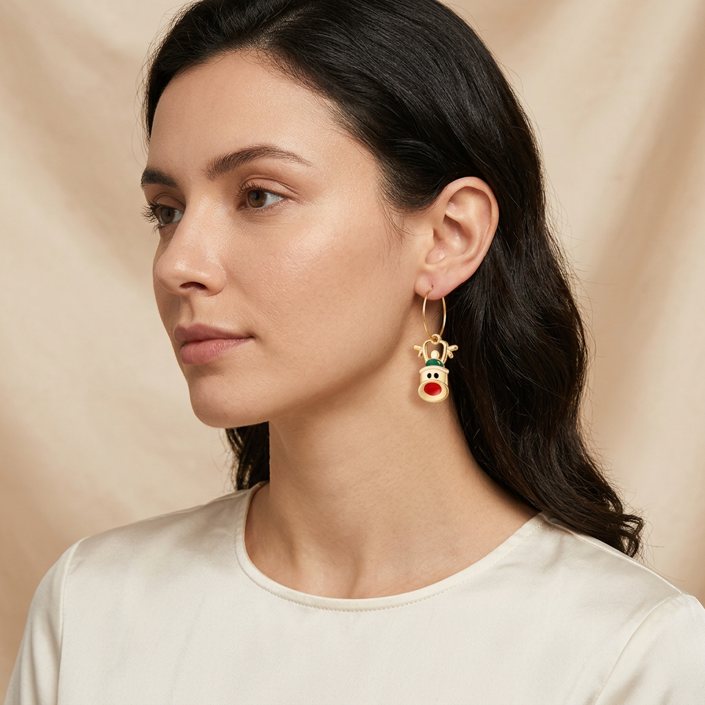 Model wearing festive reindeer enamel hoop earrings