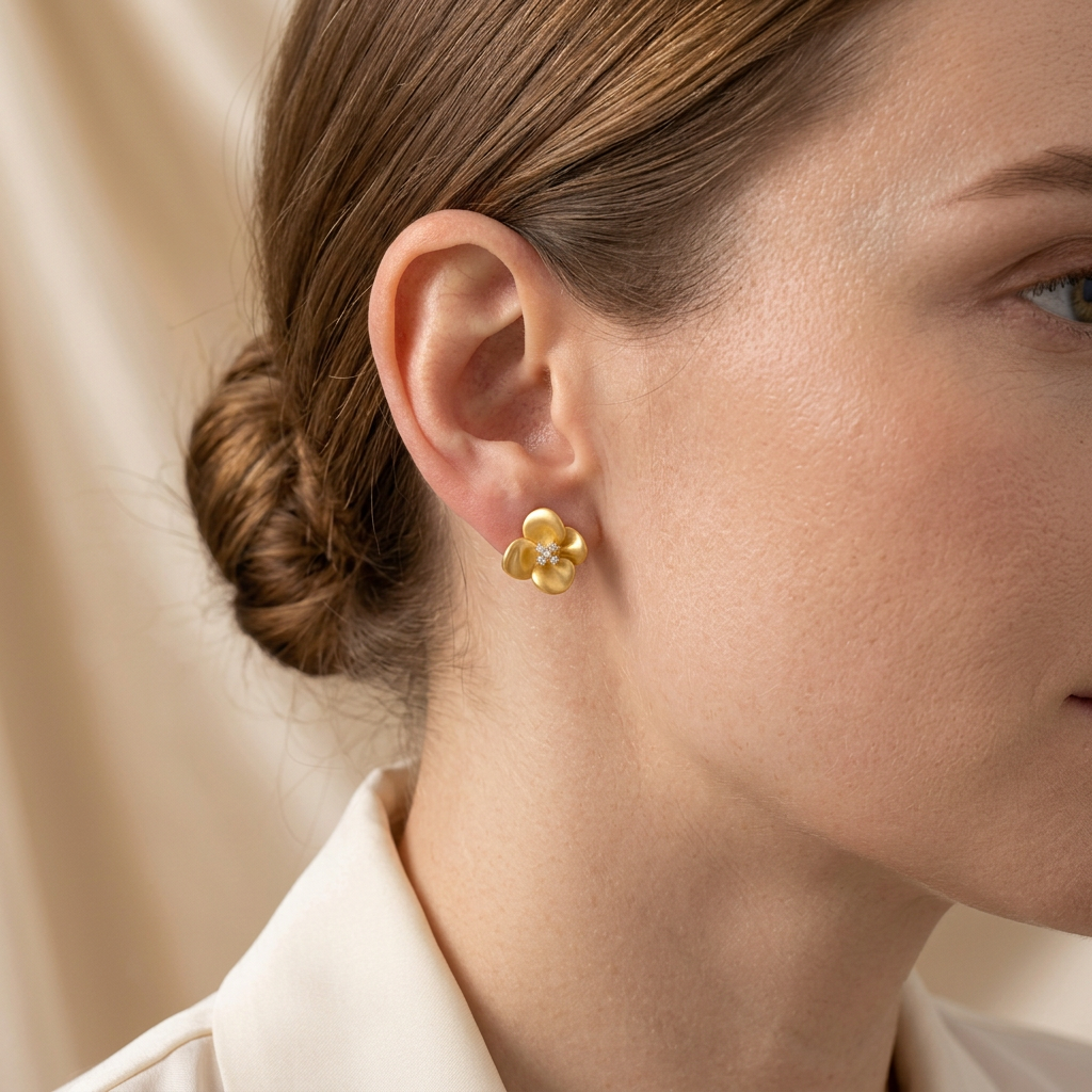 Model wearing Golden Petal Flower Stud Earrings in side profile
