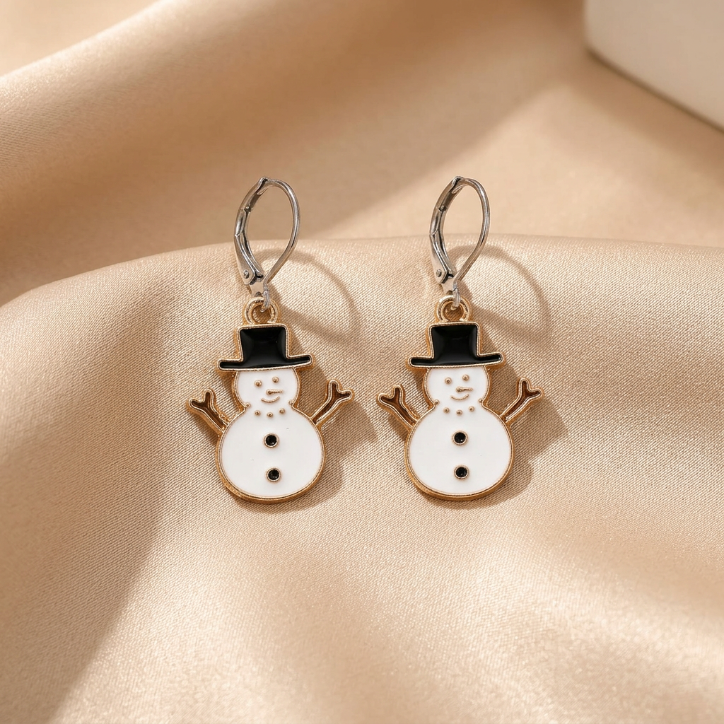 White snowman drop earrings with black hats on champagne satin