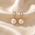 Classic Pearl Drop Earrings on ivory satin