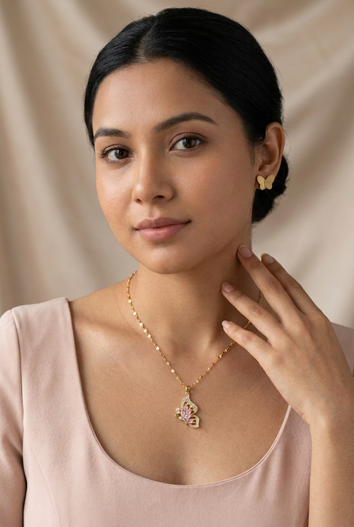 Model wearing Blush Butterfly Sparkle Necklace styled with the catalog's Gold Butterfly Style earrings, earrings sold separately