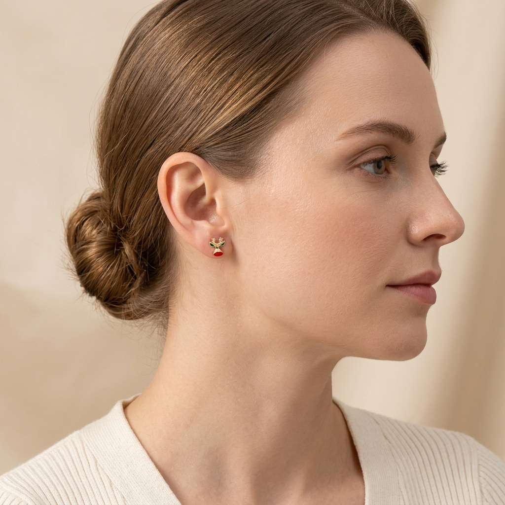 Model wearing tiny Red Nose Reindeer Studs