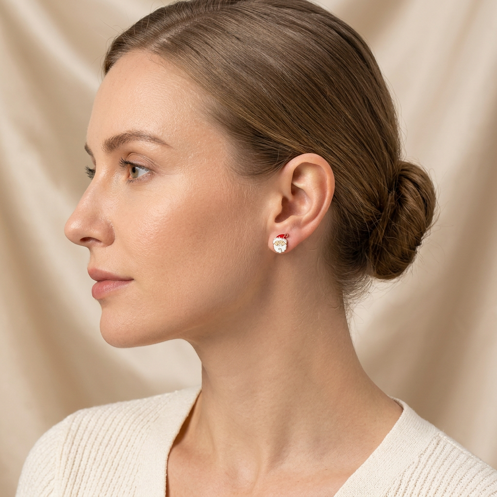 Model wearing tiny Santa stud earrings